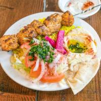Shish Tauk Platter · grilled chicken kabab, with rice, salad, garlic sauce, & bread