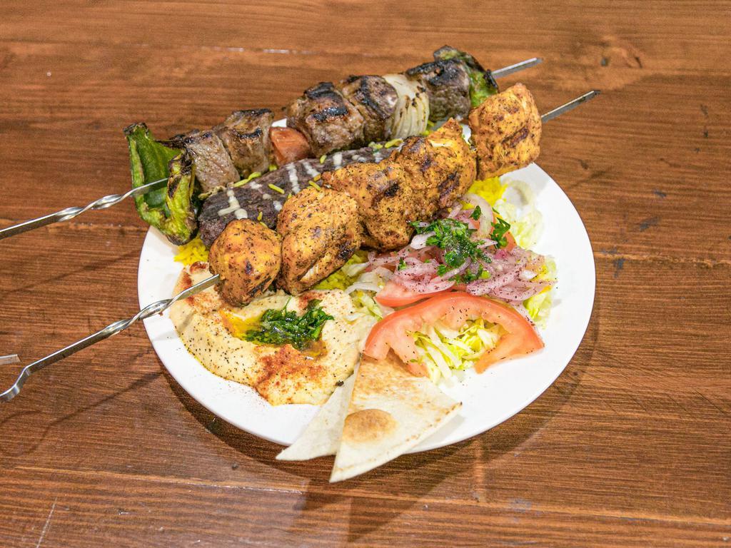 Mixed Grill Platter · 3 kebabs: chicken, lamb, & kofta chicken kebab with rice, salad, garlic/tahini sauce, & bread