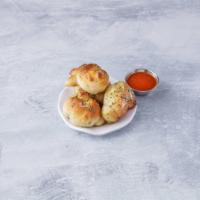 Garlic Rolls with Sauce · 4 pieces. Bread with butter and garlic topped with sauce. 