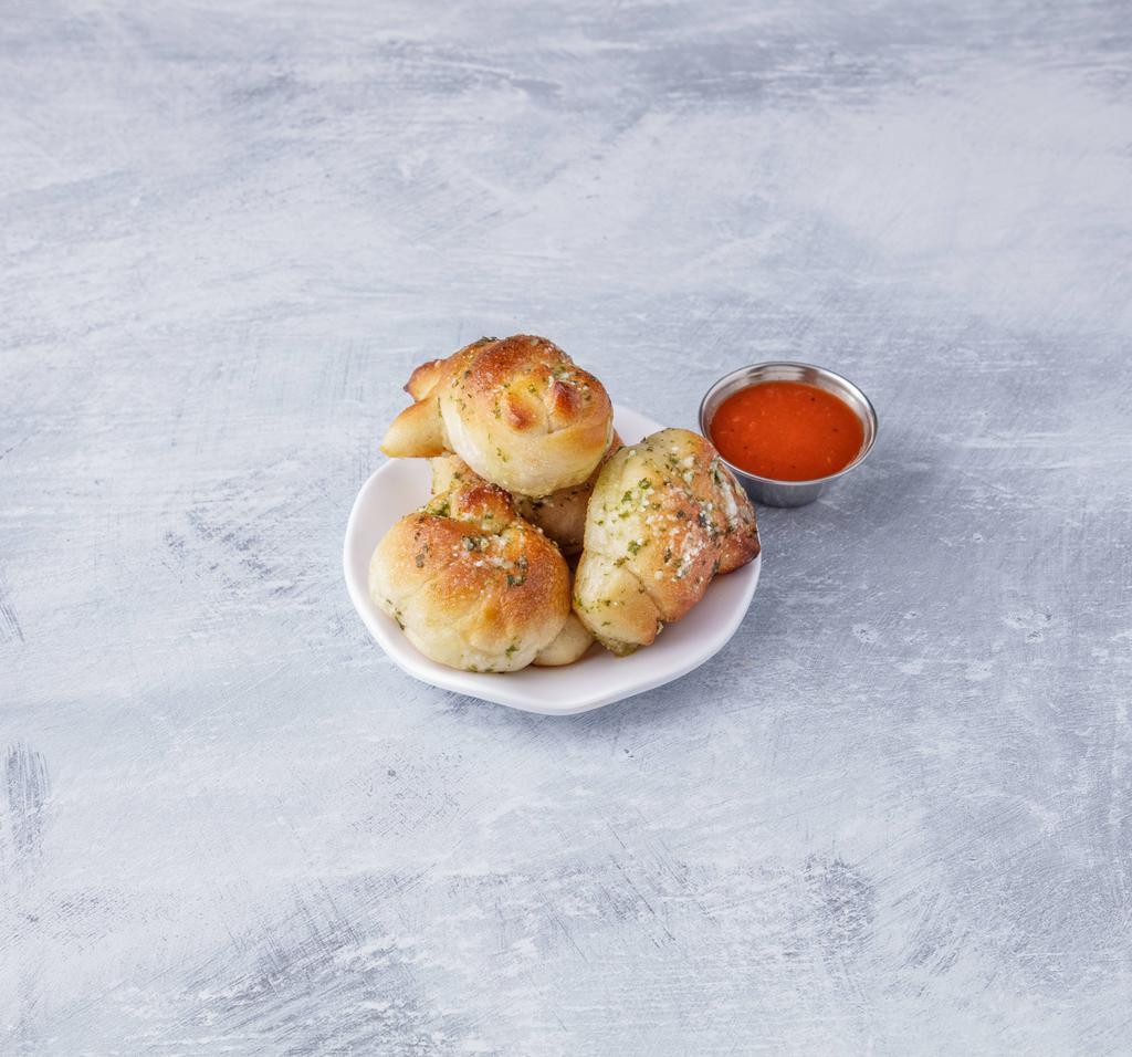 Garlic Rolls with Sauce · 4 pieces. Bread with butter and garlic topped with sauce. 