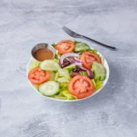 House Salad · Romaine spring mix, tomato, onion, cucumbers, olives and carrots.