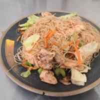 Pancit Bihon · Rice noodle with chicken and sauteed carrots, celery and cabbage.