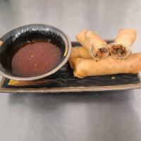 Veggie Lumpia Rolls · Broccoli stalk, red cabbage, carrot, green beans, yellow onion and green onion sauteed in ga...