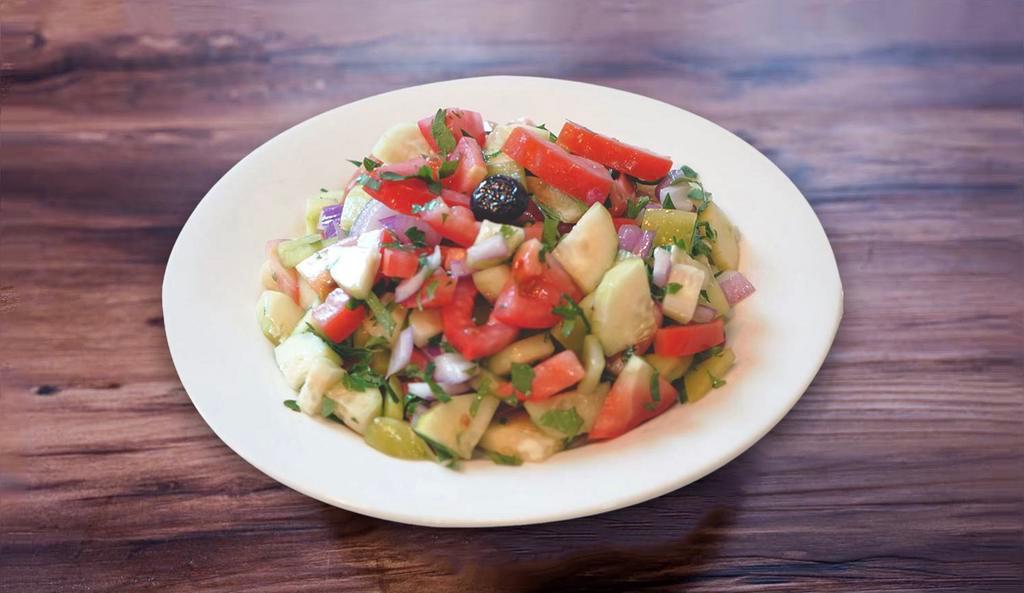 3. Shepherd Salad ·  Freshly diced tomatoes, cucumbers, green peppers, onions,  parsley, olives, olive oil and lemon juice.