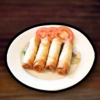 21. Sigara Borek · Pan fried phyllo roll with stuffed feta cheese and parsley.