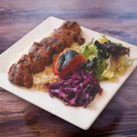 40. Lamb Shish Kebab · Marinated chuncks of lamb grilled to delight on skewers served  with rice and salad.
