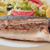 46. Mediterranean Whole Sea Bass · Char-grilled whole seabass served with crispy greens.