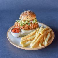 Fried Chicken Sandwich · A burst of savory and spicy flavor in every bite, with Sriracha soy, Brussel sprout slaw, ca...