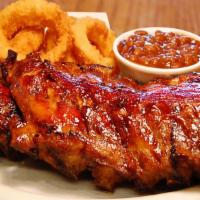 Baby Back Ribs 1/2 Rack · Comes with two sides and choice of bread (Serves 1 Person)