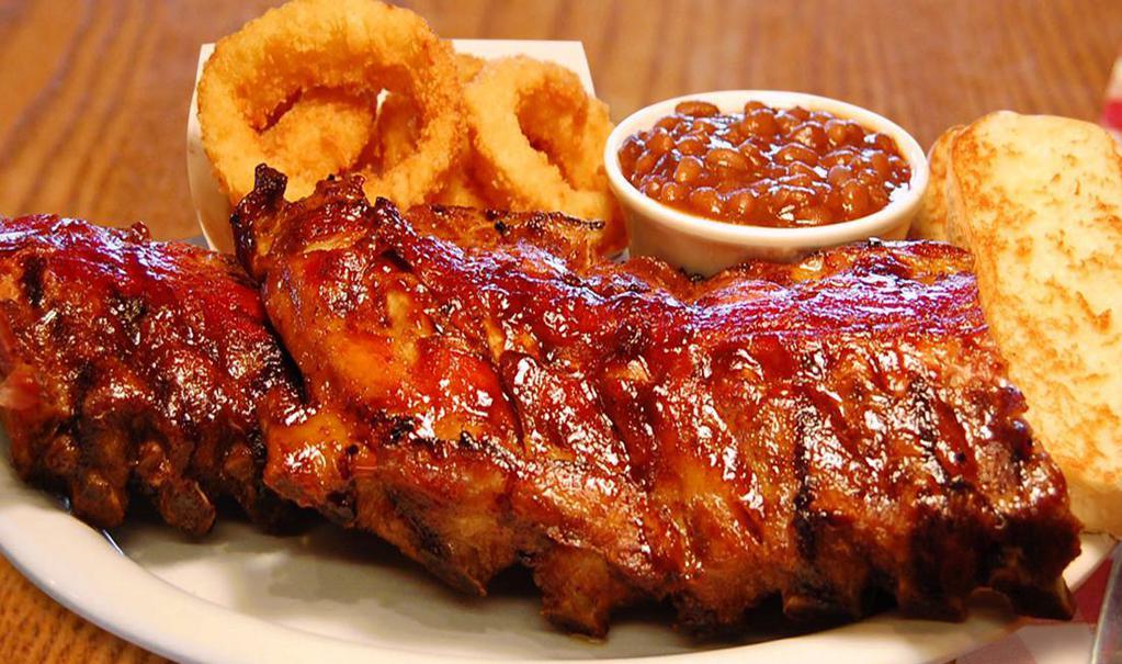 Baby Back Ribs 1/2 Rack · Comes with two sides and choice of bread (Serves 1 Person)