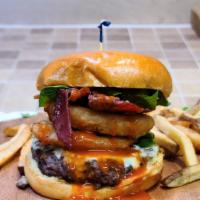 The Mascular Burger · Bacon, onion rings, Buffalo sauce, choice of cheese. 