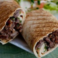 Beef shawarma sandwich  · Beef shawarma, onion , tomato and green peppers served in tortilla bread with tahini sauce 