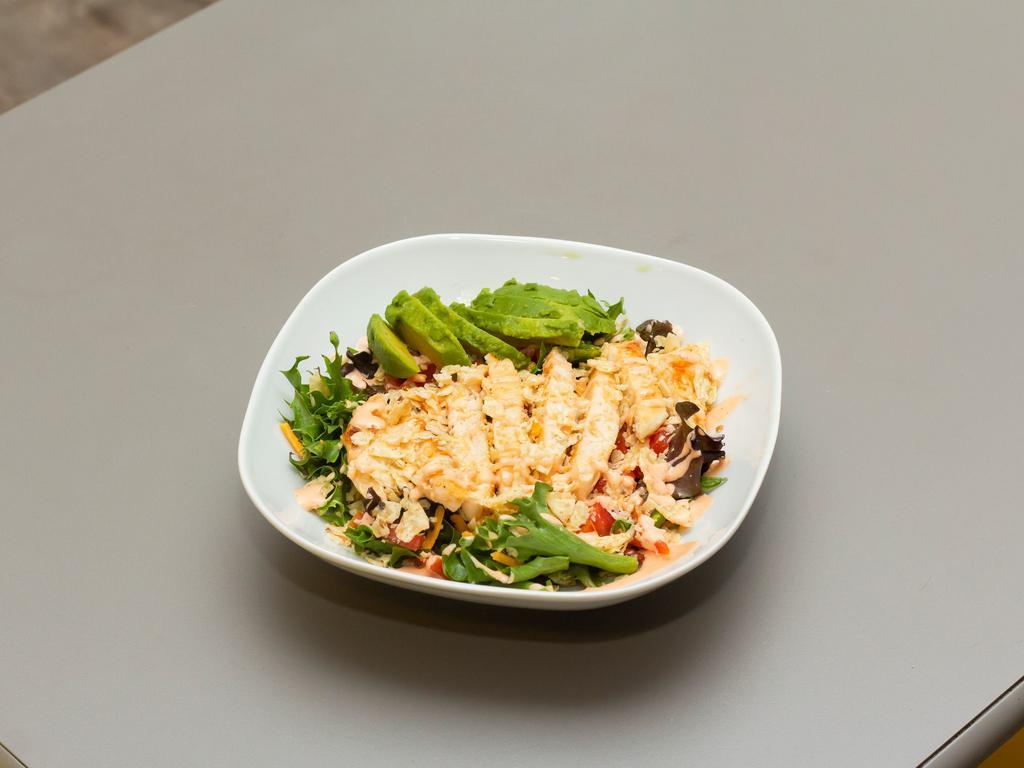 PF Southwest Salad · Grilled chicken breast, avocado, tomato, cheddar cheese, and crushed tortilla chips on a bed of greens. Served with a sriracha ranch dressing.