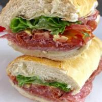 The Holy Trinity Sandwich · Capicolla, prosciutto, soppressata, jalapenos, lettuce, tomatoes and
provolone cheese.
Inclu...