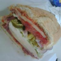 The John Dolmayan Sandwich · Pastrami, chicken, jalapenos, onions, tomatoes, lettuce and provolone
cheese.
Includes mayon...