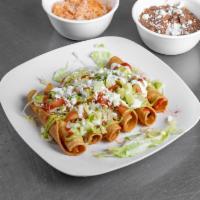 Beef Flautas  · 6 meat flautas topped with guacamole, sour cream, tomato sauce and salsitas green and red