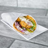 The Falafel Sandwich · Our signature blend of falafels deep fried into a golden crust with the perfect fluff on the...