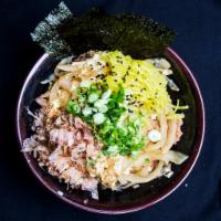 32. Pork Donbury · A bowl of rice topped with Pork katsu, onion, egg simmered with donburi sauce. Served with p...