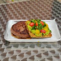 Beyond Avocado Toast · Vegan. Plant based patty, avocado puree, and watercress on seven grain toast. 