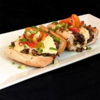 Fun Do Philly Cheesesteak · Thinly sliced rib eye steak, fondue cheese, wit' caramelized onions, and house cured sweet p...