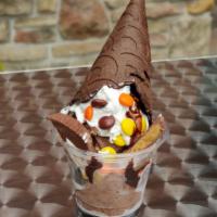 Poppin' Peanut Butter Sundae · Chocolate-peanut butter ice cream, hot fudge, Reese's pieces and peanut butter cups, whipped...