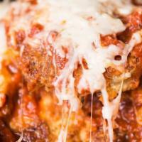 Eggplant Parmesan · Our amazing freshly breaded eggplant in an amazing tomato basil sauce and cheese.

