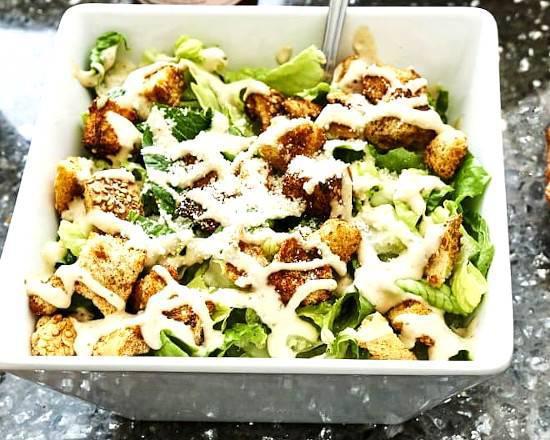 Caesar Salad · Romaine lettuce served with our In-house made croutons, Parmesan and Caesar dressing