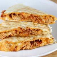 Chicken Quesadilla · A Mexican dish consisting of a flour tortilla filled with cheese, chicken, and vegetables.
