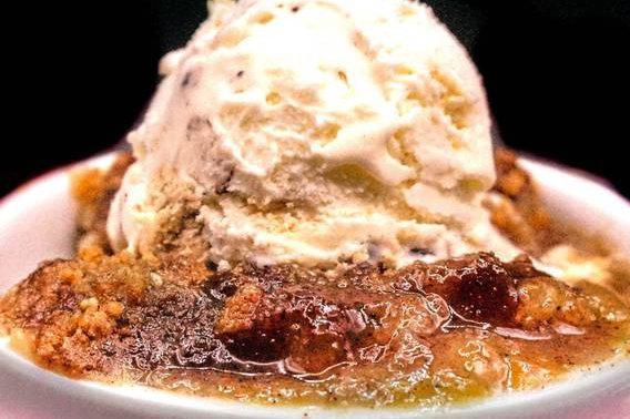 Peach Cobbler Dump Cake · Homemade buttery peach and cinnamon dessert with sweet, tender cake with a beautifully crisp cobbler strussel topping. (Best served with vanilla ice cream)

***Ice cream is not inluded.