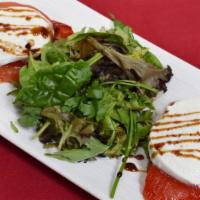 Buffalo Mozzarella · Roasted peppers, sliced tomatoes, balsamic reduction sauce.