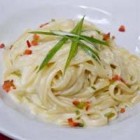 Fettuccine Alfredo · Homemade marriage of cream sauce. Add chicken or shrimp for an additional charge.