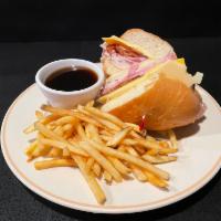 Club Dip Sandwich · Our popular club sandwich with turkey, ham, American and Seiss cheese, and bacon toasted on ...