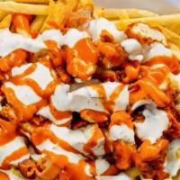 Tylor Fries · A pile of fries topped with crispy chicken, bacon, Buffalo sauce, and bleu cheese dressing.