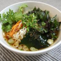 Hot udon Noodles in Vegan Broth · wheat noodles in vegan broth with seasonal vegetables, scallions, yuzu, spices.