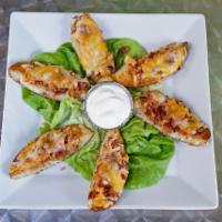 Potato Skins · Bacon and cheddar with sour cream.