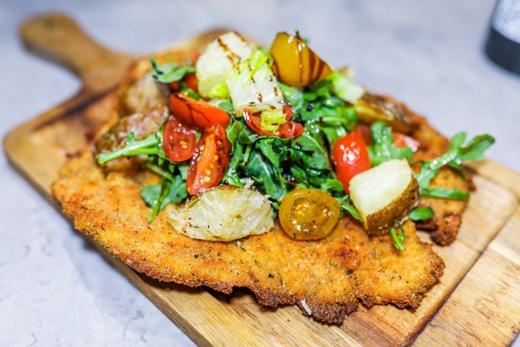 Cotoletta alla Milanese  · Breaded cutlet with a side of french fries or salad.
