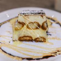 Tiramisu · Layers of espresso drenched sponge cake divided by mascarpone cream, dusted with cocoa powder.