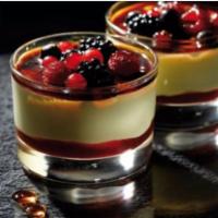 Crème Brûlée & Berries  · A layer of raspberry sauce topped with a creamy custard and decorated with mixed berries coa...