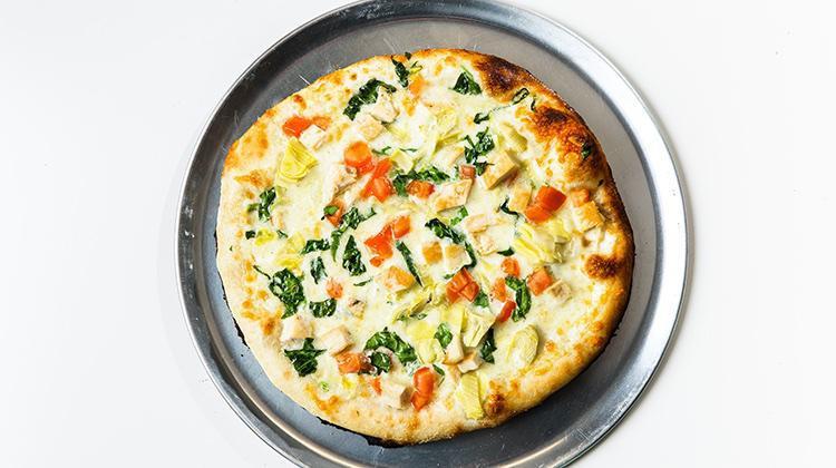 Chef's Fave · Grilled chicken, artichoke hearts, spinach, tomatoes, garlic cream sauce, house cheese blend.