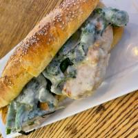 Grilled Chicken and Broccoli Rabe Hero · Served on seaded hero. Grilled chicken, garlic, broccoli rabe and cheese.