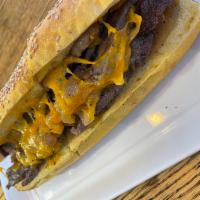 The Philly Hero · Served on seaded hero. Chopped steak and caramelized onion & cheese 