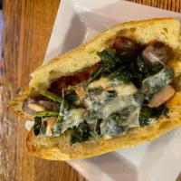 Sausage and Broccoli Rabe Hero · Served on seaded hero. Sweet Italian sausage, broccoli rabe and cherry peppers served w spic...