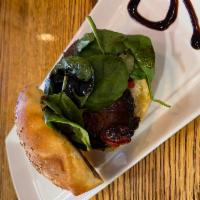 Roasted Portabello on Roll  · Served on bun. Roasted portobello, roasted tomato, baby spinach and balsamic glaze. 