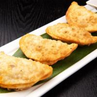 Beef Empanadas · 4 pieces. Fried pocket filled spiced ground beef with a spicy sauce.