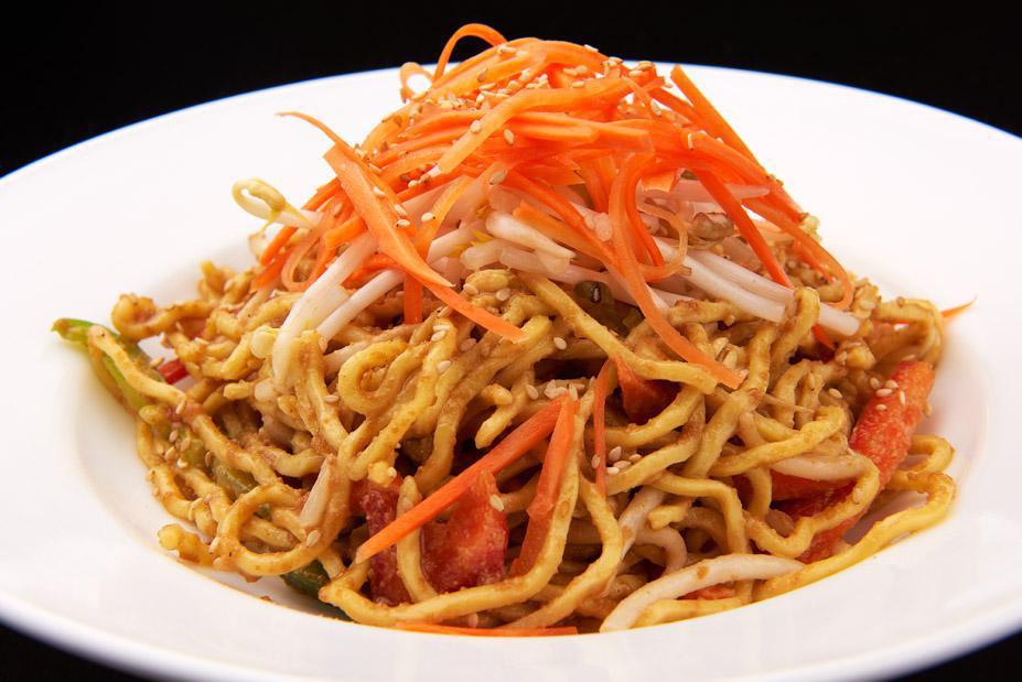 Cold Sesame Noodles · Noodles and julienne cut carrots and celery with peanut sauce topped with sesame and peanuts.