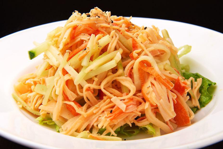Spicy Kani Salad · Shredded kani, cucumber served on top of a bed of romaine lettuce.