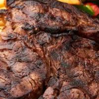 Aged Rib Steak · 22 oz. rib steak.