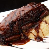Glazed Short Ribs · Braised short ribs topped with cranberry sauce.