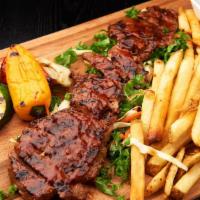 Sino Steak · Grilled flatiron steak marinated in a delicious sino sauce served with grilled vegetables an...