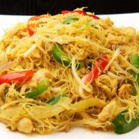 Singapore Chicken · Angel hair rice noodles are stir-fried in a wok with chicken, vegetables, seasoned with madr...